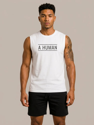 A HUMAN™ white statement tank top front view on male model with black A HUMAN boxed logo on chest, worn with black shorts, beige background