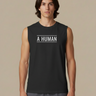 A HUMAN™ black statement tank top front view on male model with white A HUMAN boxed logo centered on chest, worn with grey shorts, beige background