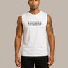 A HUMAN™ white statement tank top front view on male model with black A HUMAN boxed logo on chest, worn with black shorts, beige background