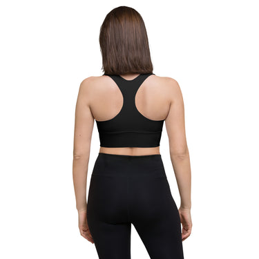 Back view of A HUMAN™ black sports bra  worn by female model